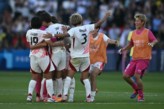 Japan players celebrate after beating Brazil in Paris with a stunning comeback on Sunday