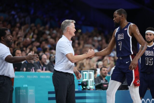 Kevin Durant (right) is congratulated by USA coach Steve Kerr during Sunday's win over Ser