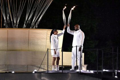 Marie-Jose Perec and Teddy Riner prepare to light the Paris Olympics cauldron