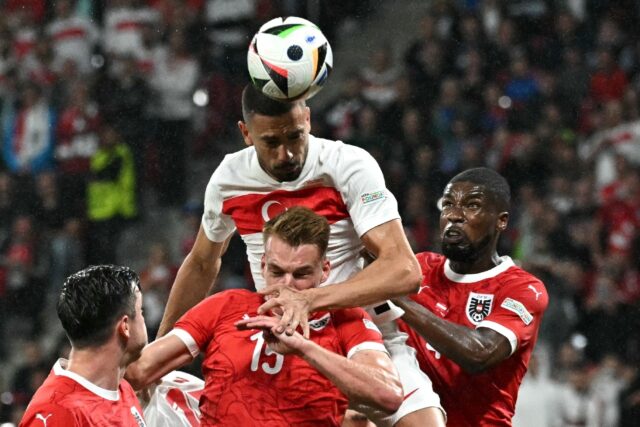 Merih Demiral (centre) was Turkey's hero with two goals against Austria