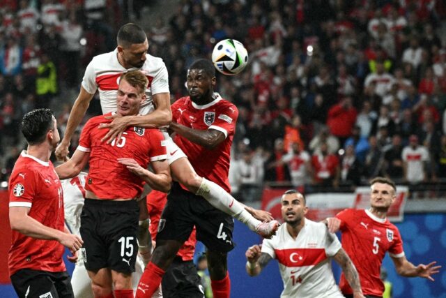 Merih Demiral (C) scored twice to send Turkey into the quarter-finals of Euro 2024