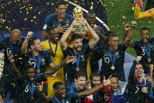 Olivier Giroud holds aloft the World Cup trophy in 2018