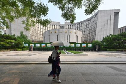 The People's Bank of China cut two benchmark interest rates in a bid to boost sluggish eco