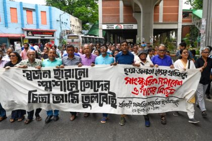 People take part in a march in Dhaka on Friday decrying the violent response to student pr