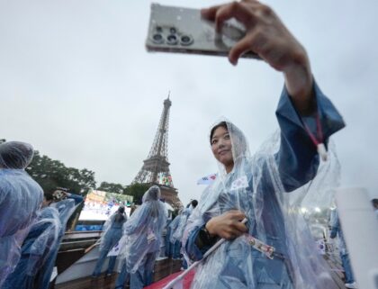 As the South Korean delegation rode a boat on the Seine River, the French-speaking present