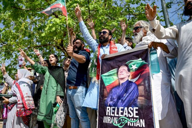 Supporters of Pakistan's former prime minister Imran Khan, celebrate after a court verdict