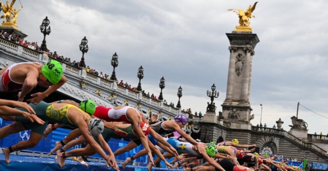 Swimmers plunge in Seine River