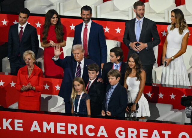 Former US president Donald Trump stands with his grandchildren during the Republican Natio