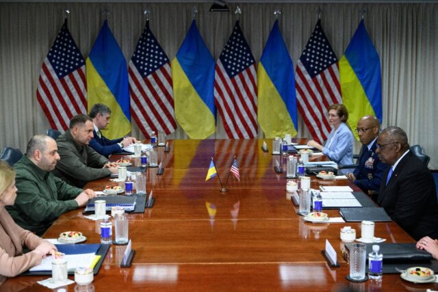 US Secretary of Defense Lloyd Austin (R) speaks during a meeting with Ukrainian Defense Mi