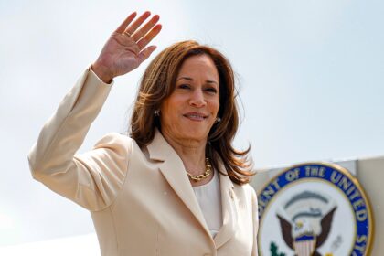 US Vice President and Democratic Presidential candidate Kamala Harris waves as she boards