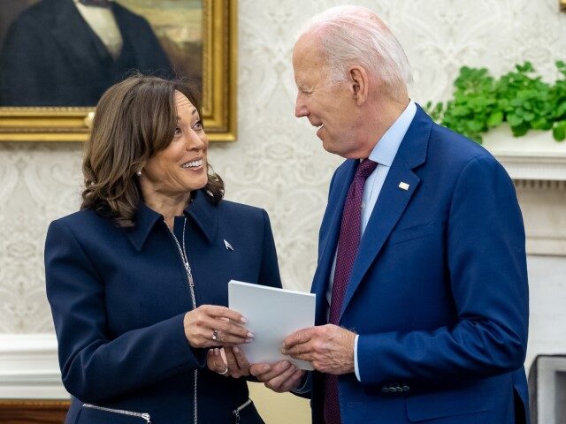 President Joe Biden talks with Vice President Kamala Harris before a meeting with Congress