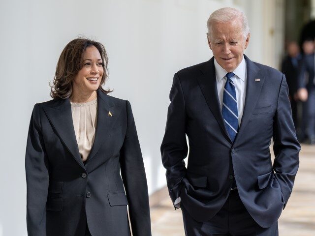 President Joe Biden and Vice President Kamala Harris walk along the West Colonnade of the