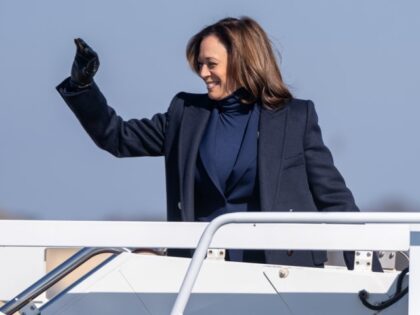 Vice President Kamala Harris waves as she boards Air Force Two at Joint Base Andrews, Mary