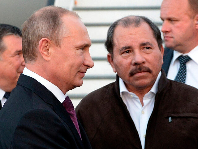 FILE - Nicaragua's President Daniel Ortega, right, and Russian President Vladimir Putin, l