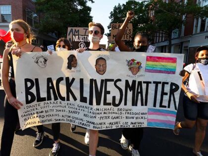 Protesters march against police brutality Friday, June 12, 2020, in Salem, Mass. (AP Photo