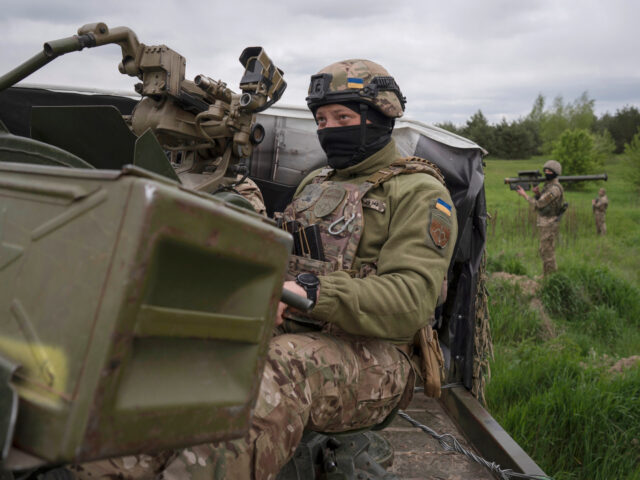 Members of a Ukrainian air-defense unit demonstrate their work near Kyiv on Monday, May 8,