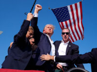 Republican presidential candidate former President Donald Trump is surrounded by U.S. Secret Service agents at a campaign rally, Saturday, July 13, 2024, in Butler, Pa. The FBI says former President Donald Trump has agreed to be interviewed as part of the investigation into the attempted assassination in Pennsylvania earlier this month. (AP Photo/Evan Vucci, File)