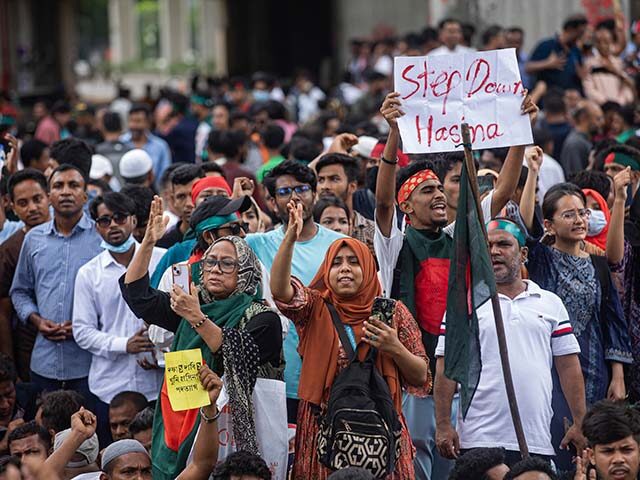 People shout slogans as they take part in a protest against Prime Minister Sheikh Hasina a