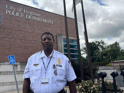 Police Chief Troy Doyle stands in front of the Ferguson Police Station on Friday, Aug. 2,