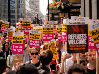 People take part in an anti-far right protest outside the London offices of the political