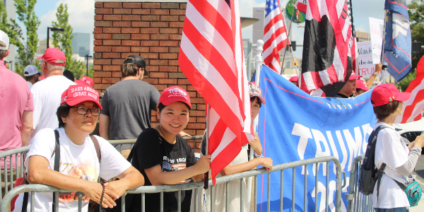 An Asian family attending the Trump-Vance rally in Atlanta. (Randy Clark/Breitbart Texas)