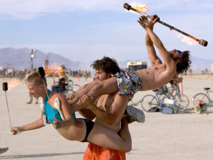 BURNINGMAN_006_CAG.CR2 Kelly Peach, left, Lebn Schuyler, center, and Jules McEvoy, right p