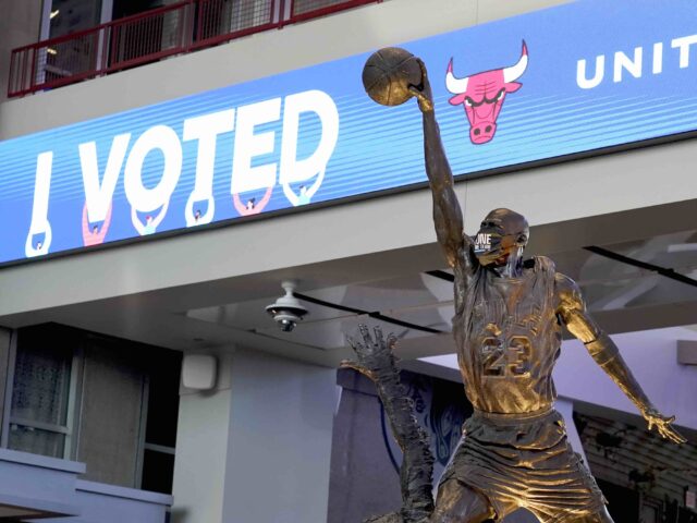 The Michael Jordan statue stands in front of an I Voted banner on Election Day, Tuesday, N