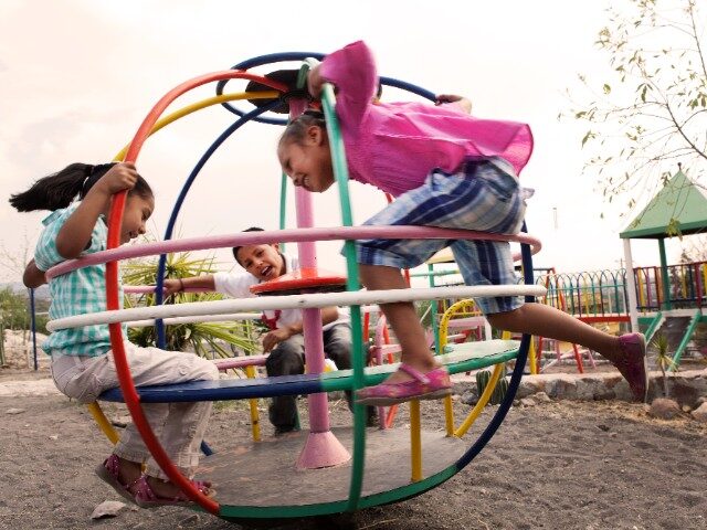 Children enjoy themselves at a playground.