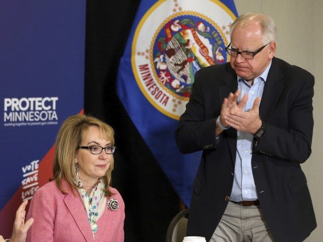 In this Oct. 26, 2018 photo, Minnesota gubernatorial candidate, Democrat Tim Walz, right,