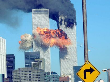 9/11 - 394261 14: A fiery blasts rocks the World Trade Center after being hit by two plane