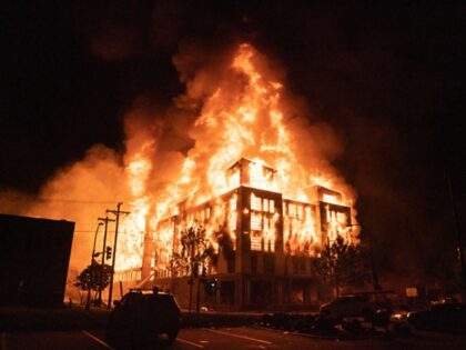 Walz - MINNEAPOLIS, MN - MAY 27: Rioters set fire to a multi-story affordable housing comp