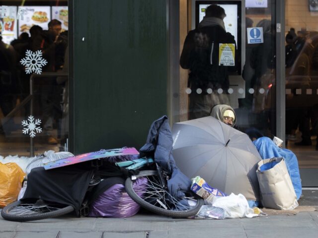 LONDON, UNITED KINGDOM - DECEMBER 26: A homeless person is seen with a bicycle and a tent