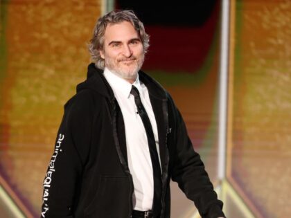 Pictured: Joaquin Phoenix walks onstage at the 78th Annual Golden Globe Awards held at The