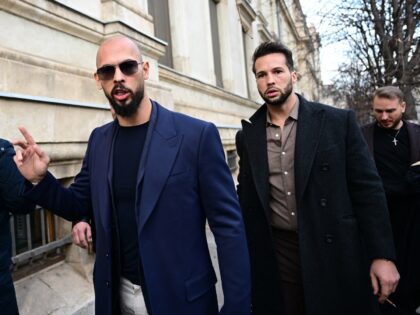 Andrew Tate (L) and Tristan Tate (R) walk from the Bucharest's Court of Appeal after a hea