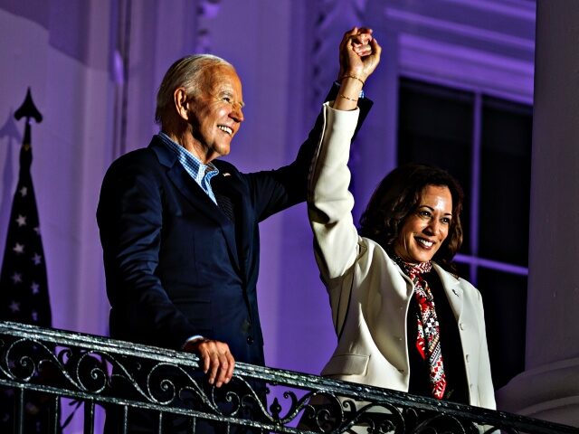 WASHINGTON, DC - JULY 4: President Joe Biden and Vice President Kamala Harris join hands i