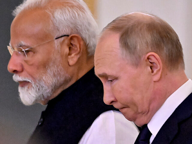 Russian President Vladimir Putin and Indian Prime Minister Narendra Modi attend a ceremony