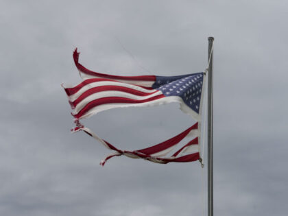 MATAGORDA, TEXAS - JULY 8: A tattered American flag flies in the wind after Hurricane Bery