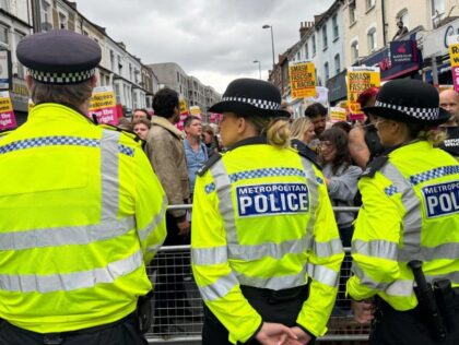 WALTHAMSTOW, UK - AUGUST 07: Police officers take security measures during a demonstration