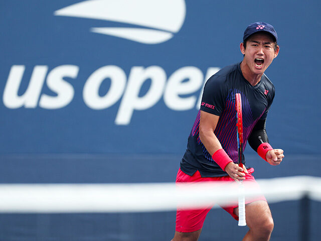 Yoshihito Nishioka of Japan celebrates a point against Miomir Kecmanovic of Serbia during