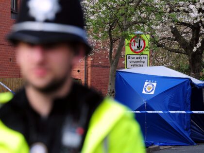 A general view of police at the scene where a 75-year-old man was stabbed to death in Smal