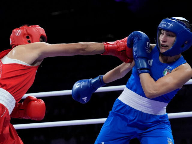 Algeria's Imane Khelif, left, fights Italy's Angela Carini in their women's 66kg prelimina