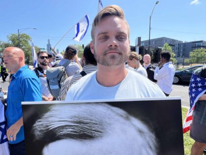 Isaac Woodward, of the pro-Israel Christian group Generation Zion, outside a pro-Palestini