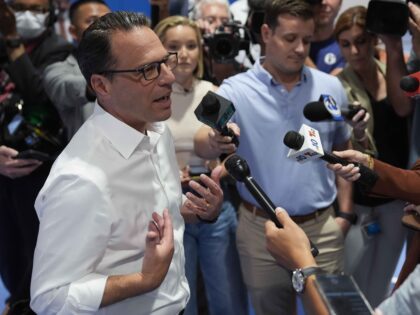 Pennsylvania Gov. Josh Shapiro speaks with members of the media during his visit to Philad