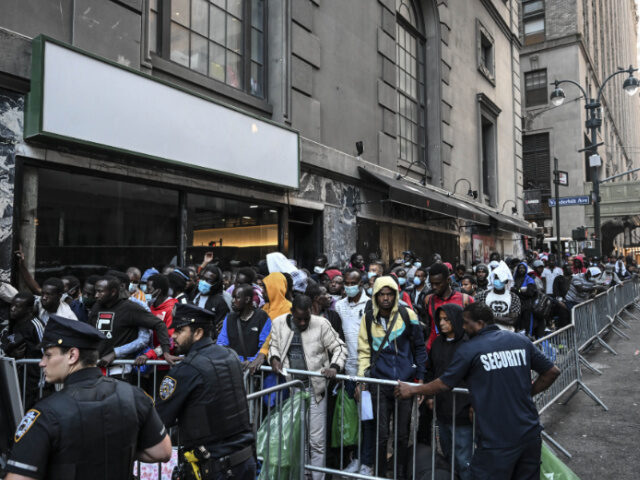 NEW YORK, US - AUGUST 02: Police officers take security measures during migrants line up o