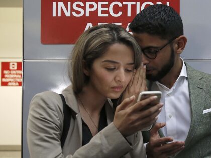 Attorney Nasrina Bargzie (left) talks with Mokhtar Alkhanshali (right) of Mocha Mill upon