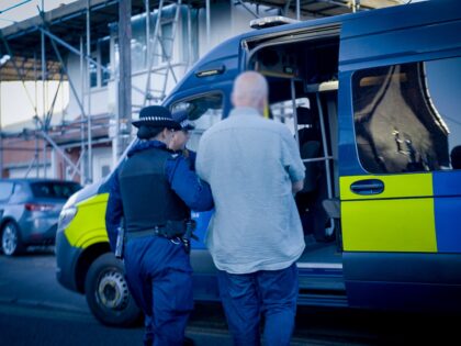 Officers arrest a man on suspicion of violent disorder at an address in Sutton (1)