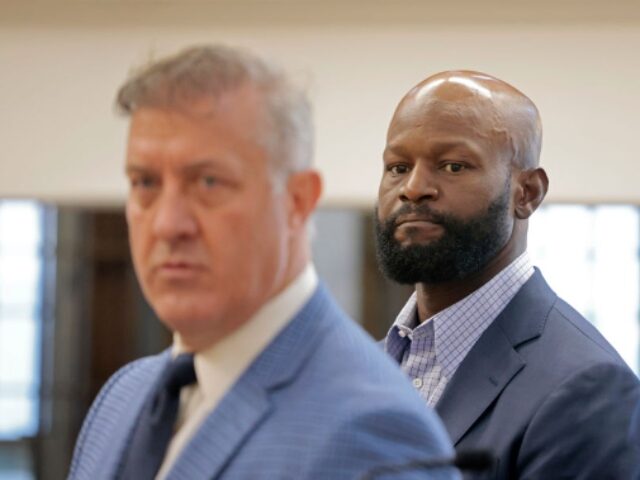 Boston, MA - August 19: With defense attorney Brian Sullivan at left, former NFL player Go