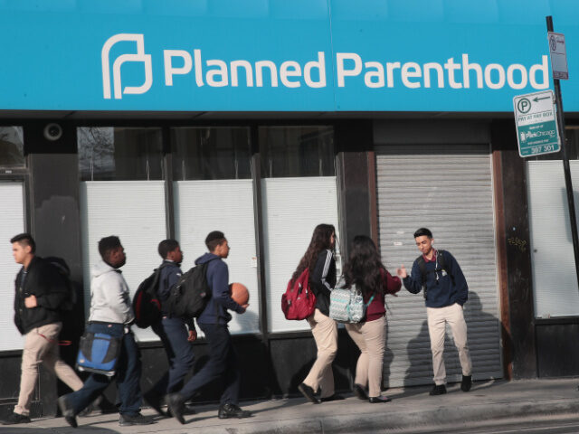 Pedestrians walk past a Planned Parenthood clinic on May 18, 2018 in Chicago, Illinois. Th