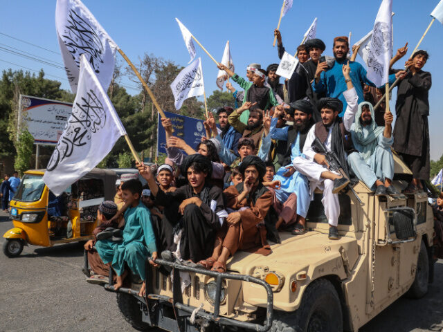 TOPSHOT - A convoy of Taliban security personnel seen moving along the streets as they cel