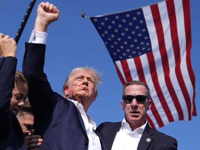 FILE - Republican presidential candidate former President Donald Trump gestures as he is s